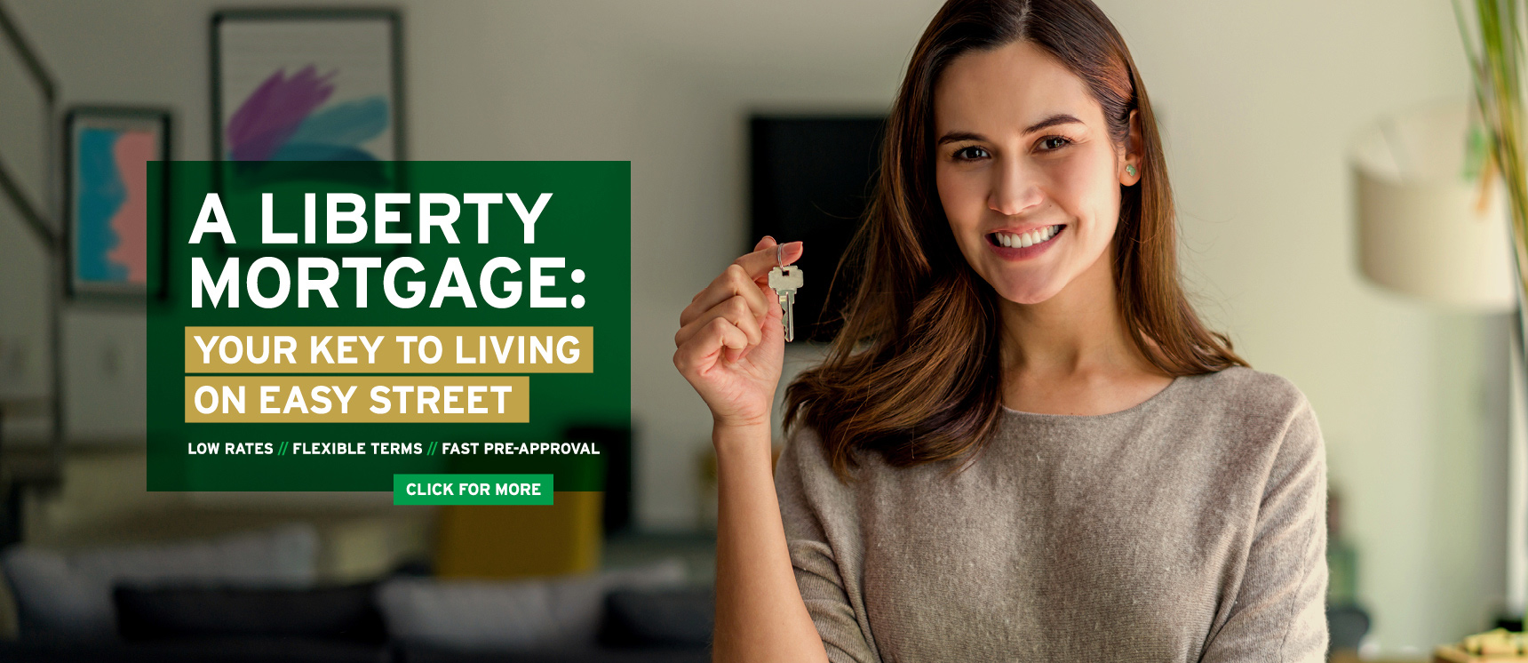 Happy woman holding the key to her new dream home. Click to learn more about mortgages.