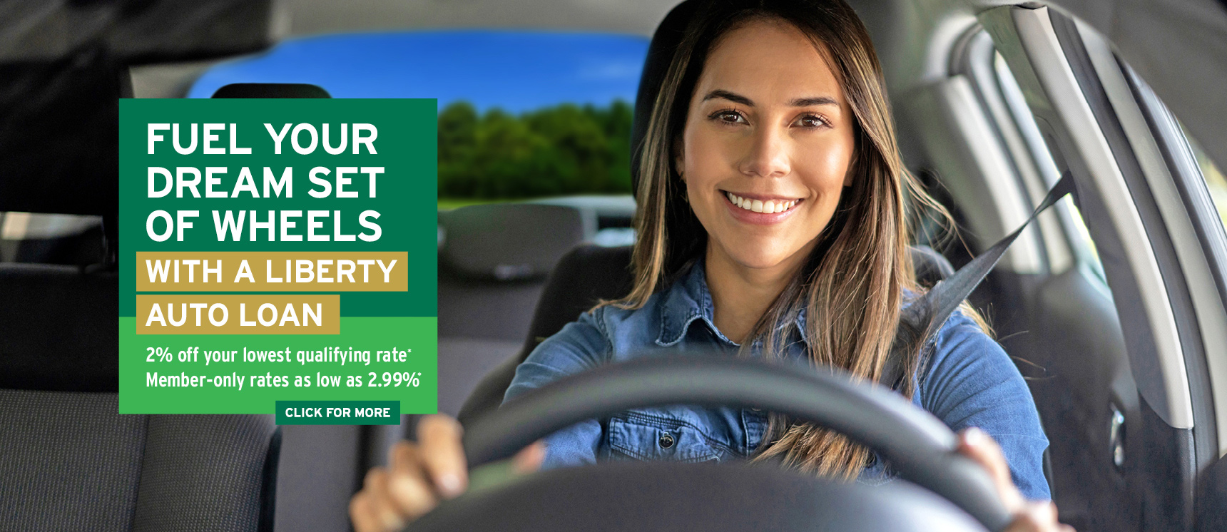 happy woman driving a car after she got a great low rate on an auto loan from Liberty Savings