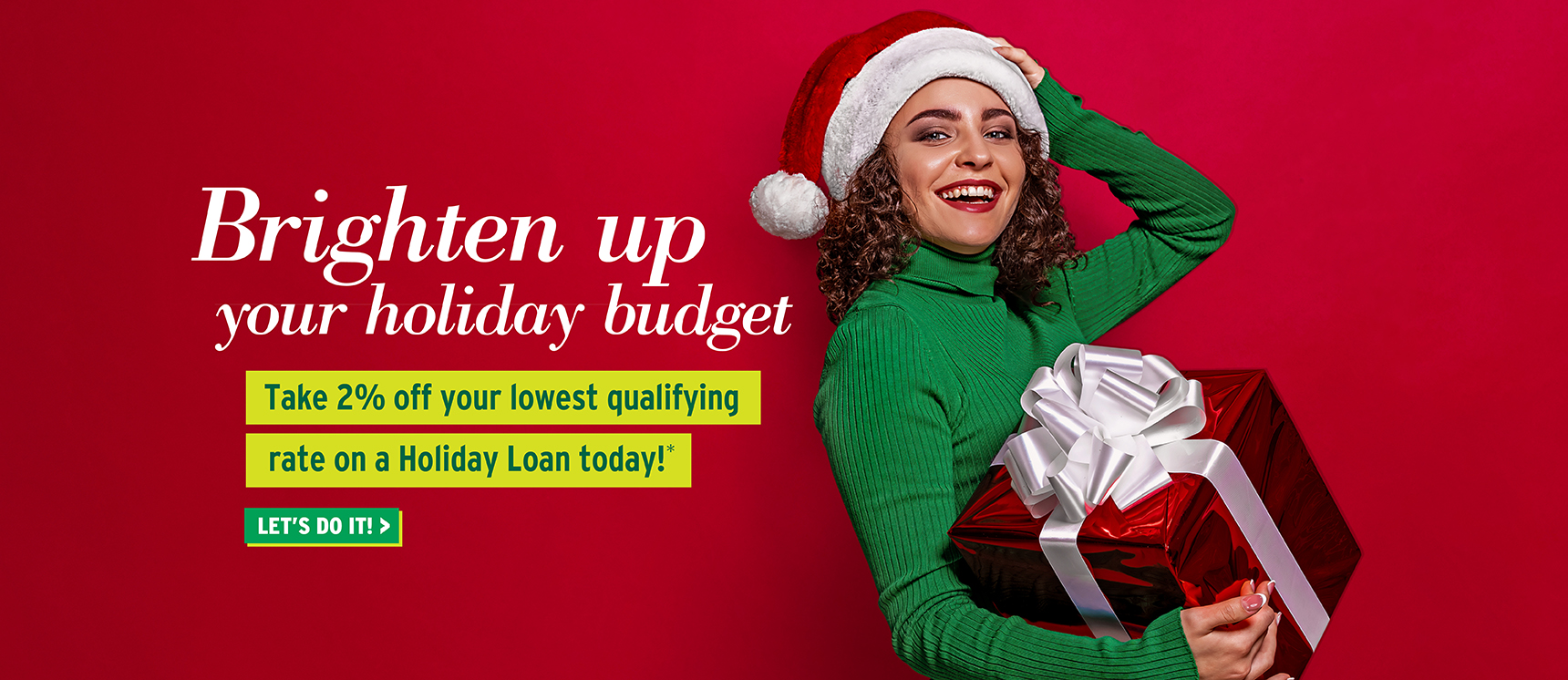 Happy woman with a holiday gift that just saved 2% on her holiday loan