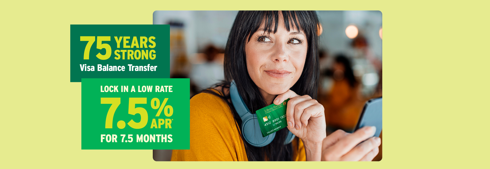 Happy woman holding Liberty Visa card that just took advantage of Liberty's special 7.5%APR for 7.5 months special. 