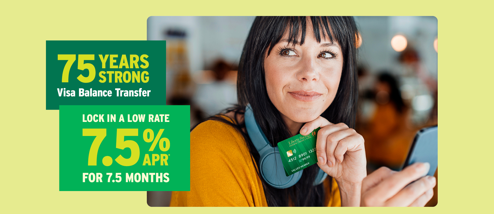 Happy woman holding her new Liberty Savings Visa Card after receiving her special 7.5% APR promotional rate